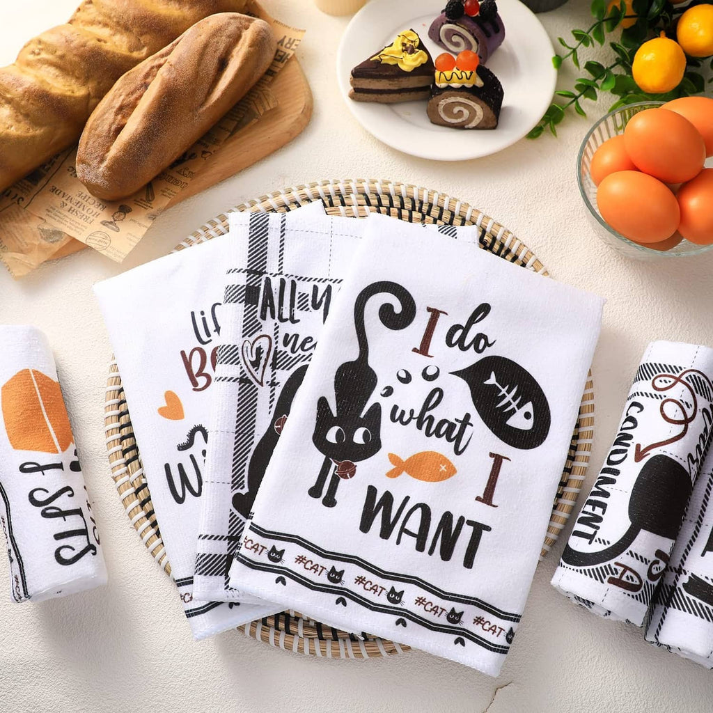 Folded set of 6 cat-themed kitchen towels, black-and-white with bold text graphics