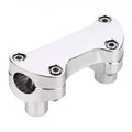 Chrome motorcycle handlebar riser clamp with four hex bolts and raised bar mounts