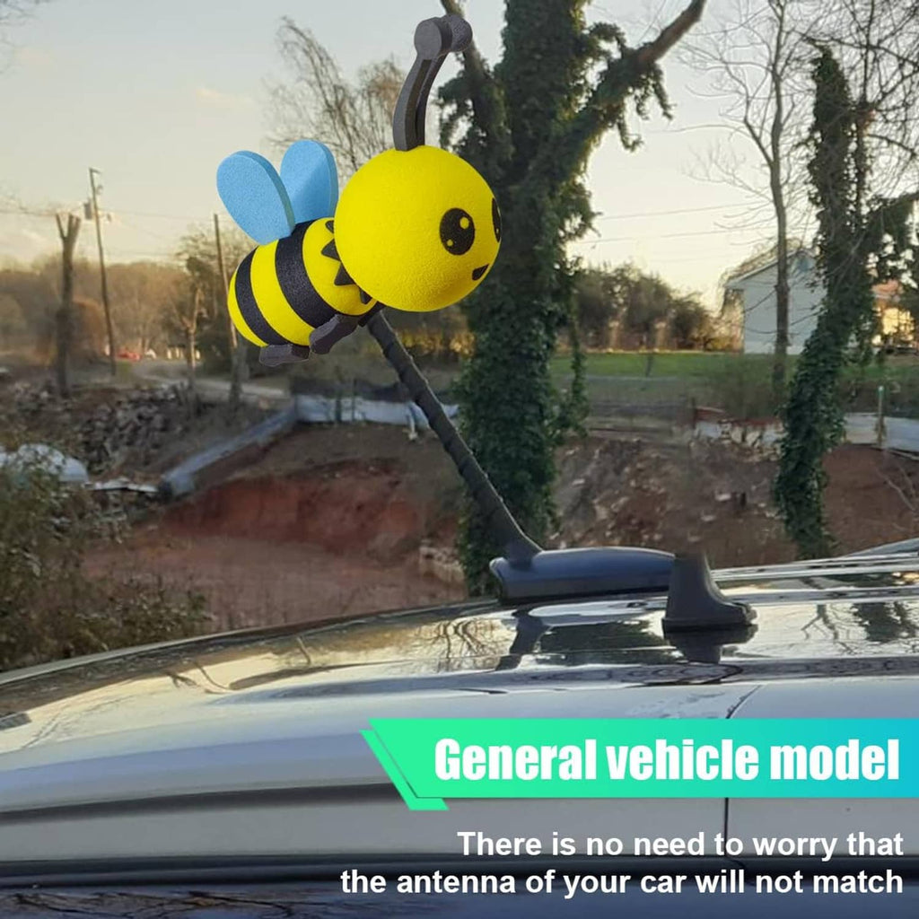 Bee foam antenna topper with yellow body, black stripes, and blue wings on antenna mast