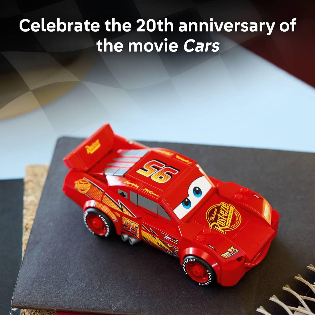 Red Lightning McQueen-style buildable race car toy with number 95, angled on base