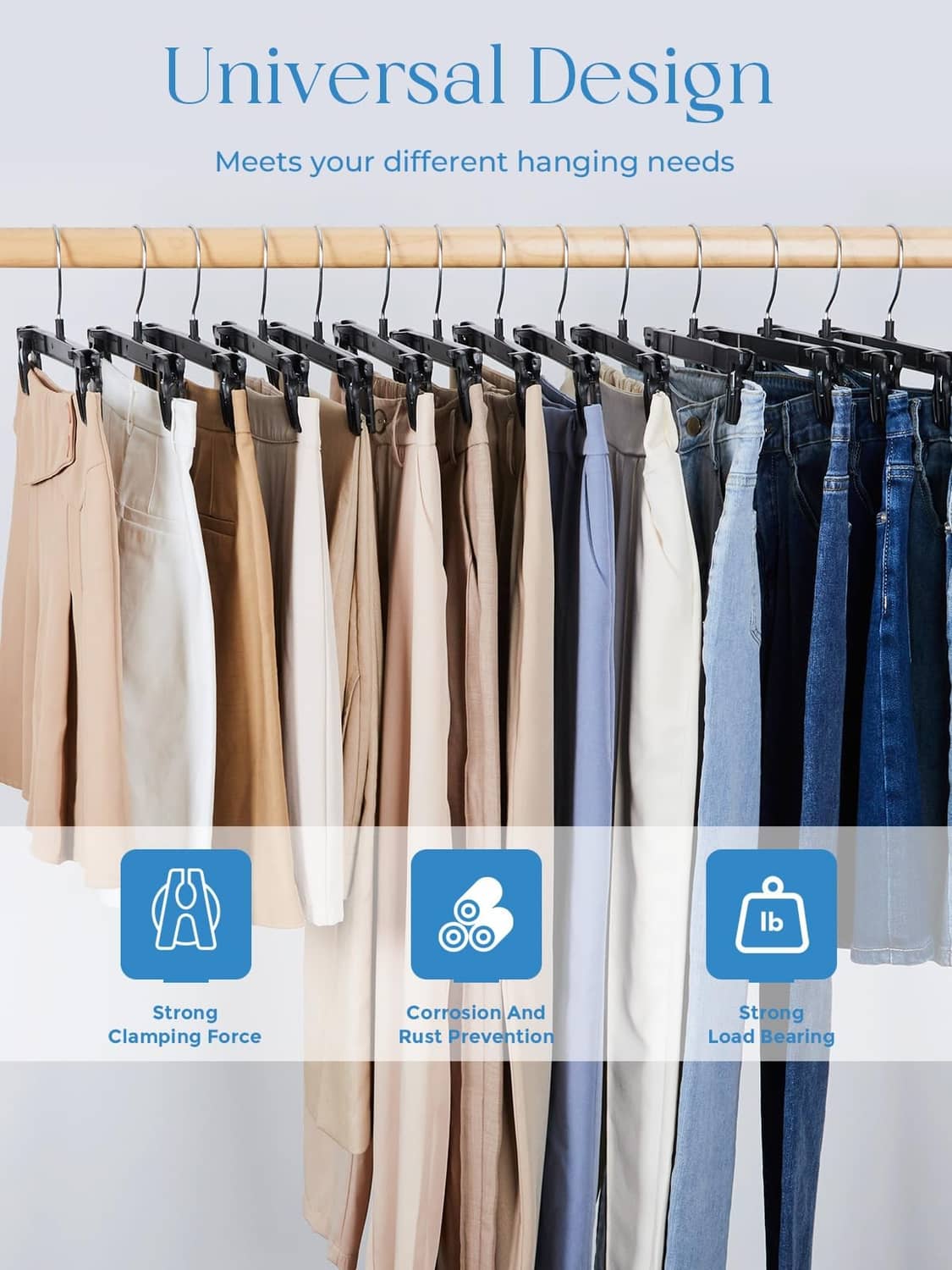 Row of black clip hangers on a rod, holding assorted pants in different colors