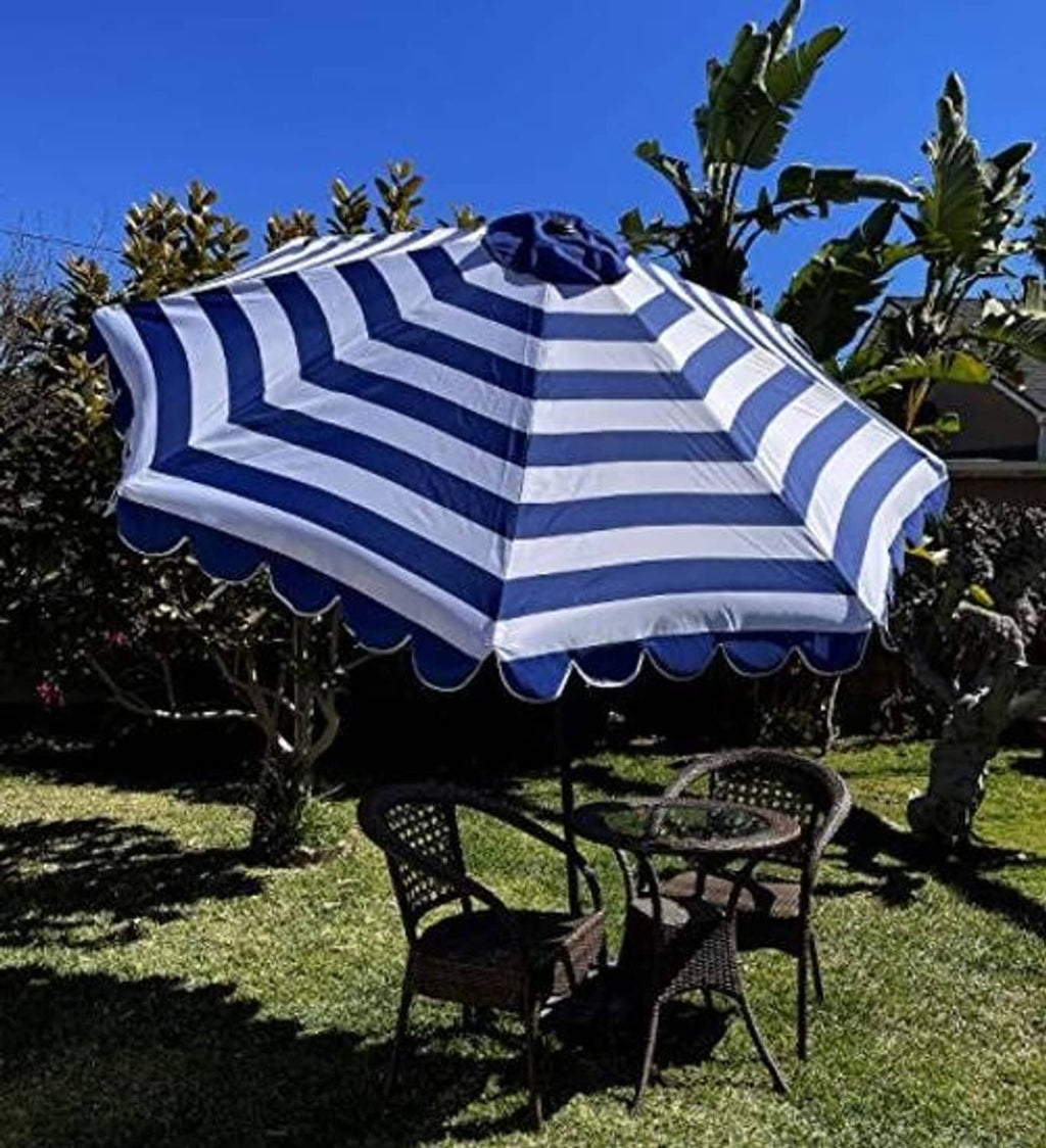 Strand-like royal and white striped umbrella canopy with scalloped edge and center medallion
