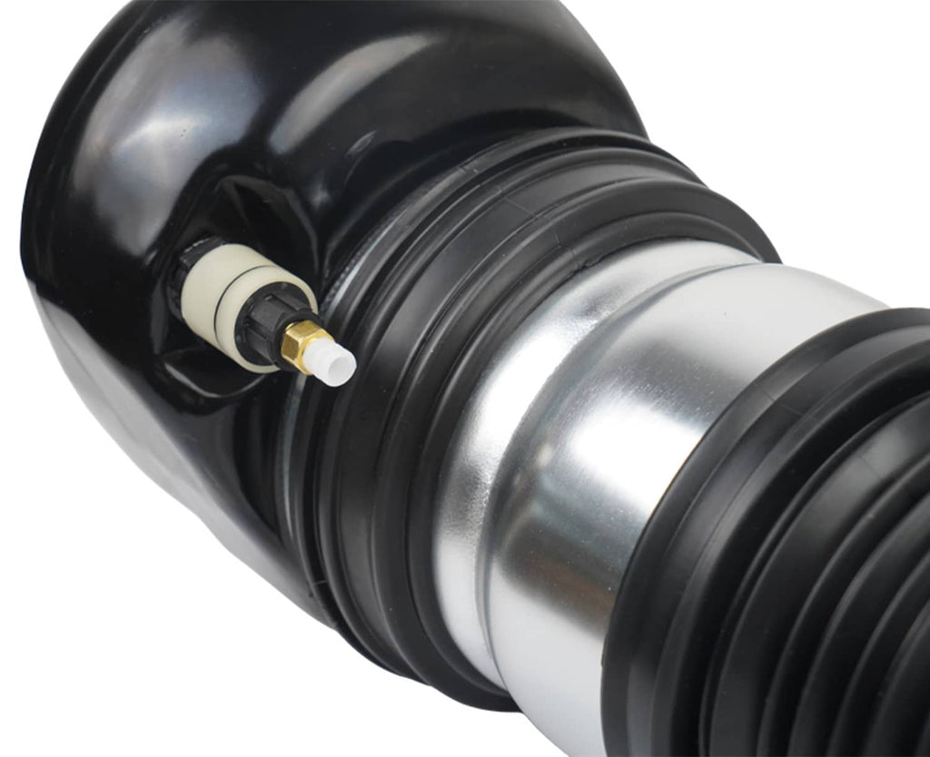 Close-up of front air suspension strut piston: silver body, black bellows, valve fitting