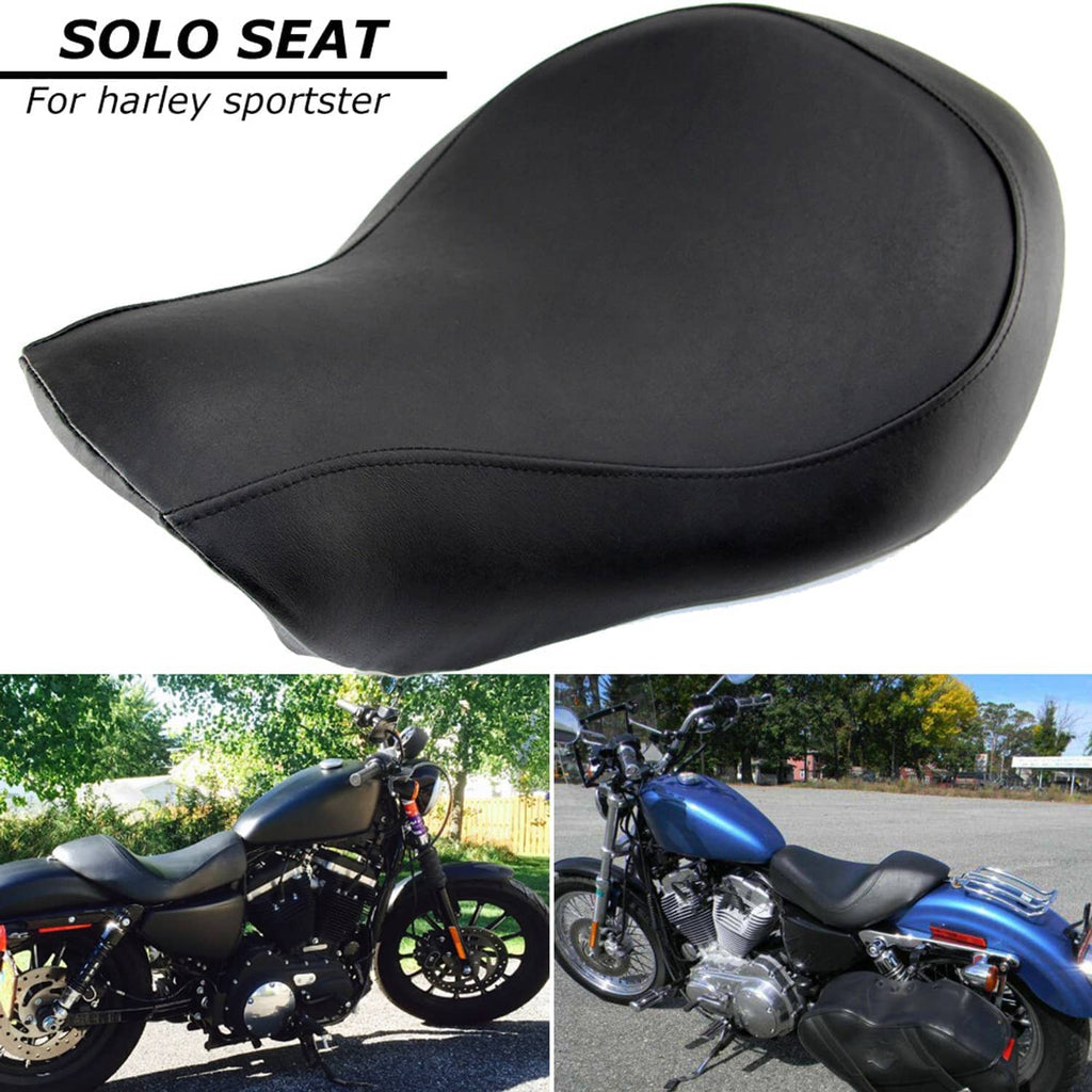 Black solo motorcycle seat, curved profile with stitched seam along the sides
