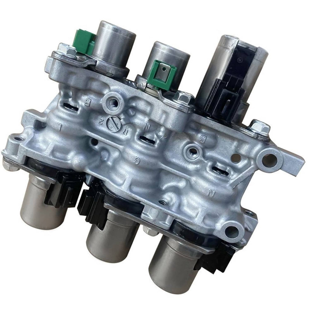 Transmission solenoid block assembly close-up with silver housing and green/black connectors