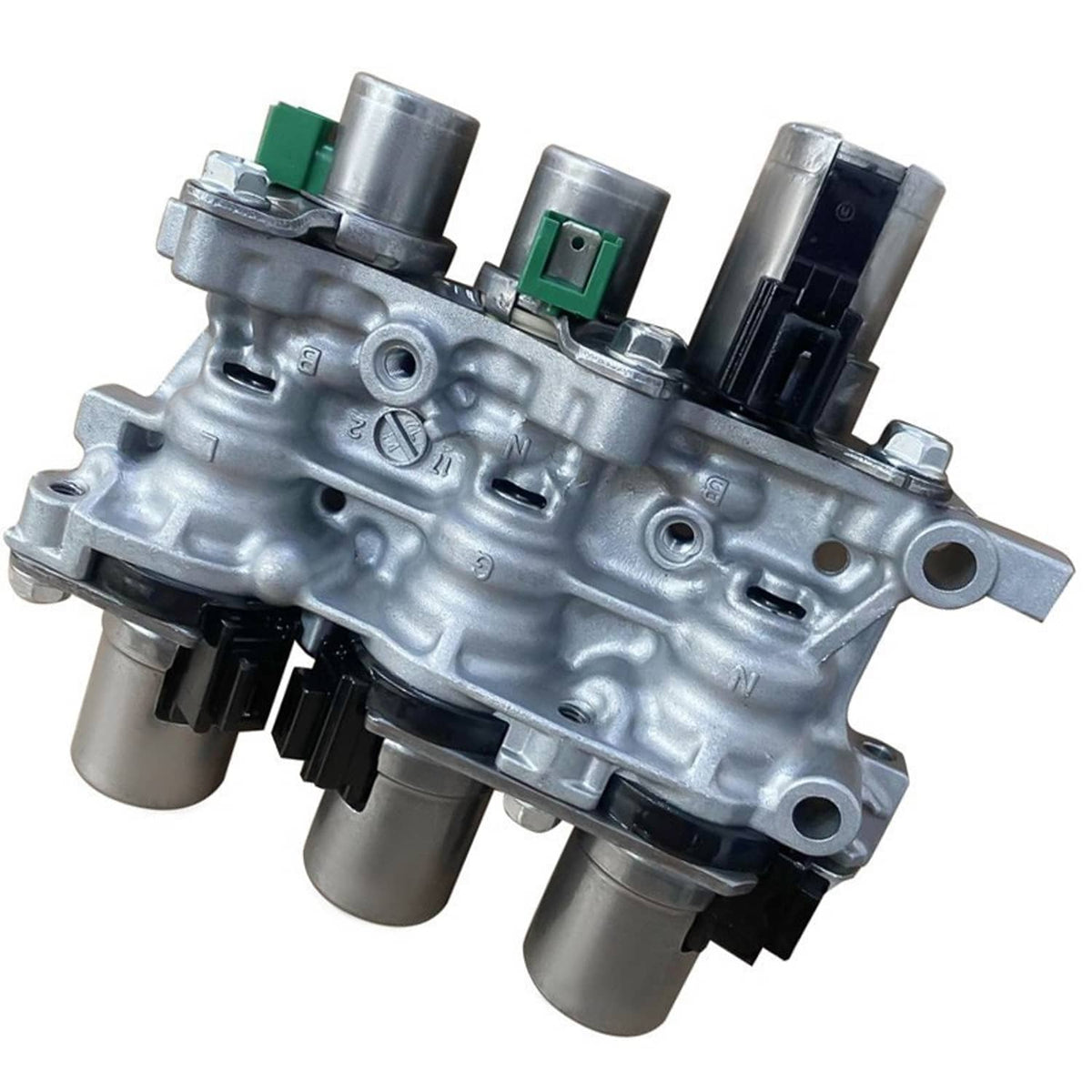 Transmission solenoid block assembly close-up with silver housing and green/black connectors