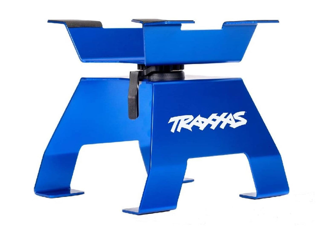 Blue aluminum TRAXXAS X-Truck stand with black handle clips