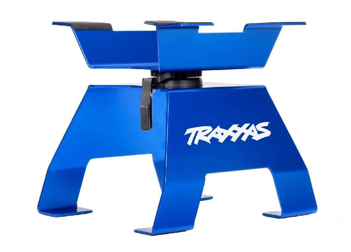 Blue aluminum TRAXXAS X-Truck stand with black handle clips