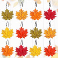 Set of leaf-shaped shower curtain hooks with metal rings in assorted autumn colors