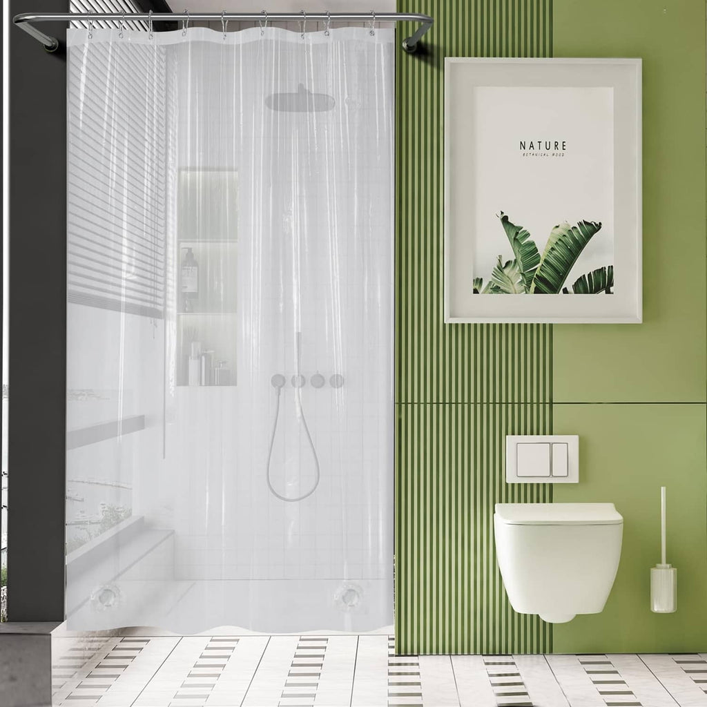 Clear shower curtain liner with metal grommets, hanging in front of a bathtub
