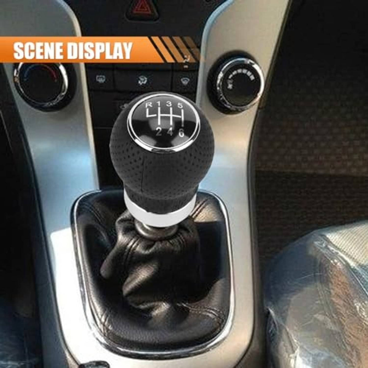 Close-up of installed black round 6-speed shift knob with chrome ring and white collar