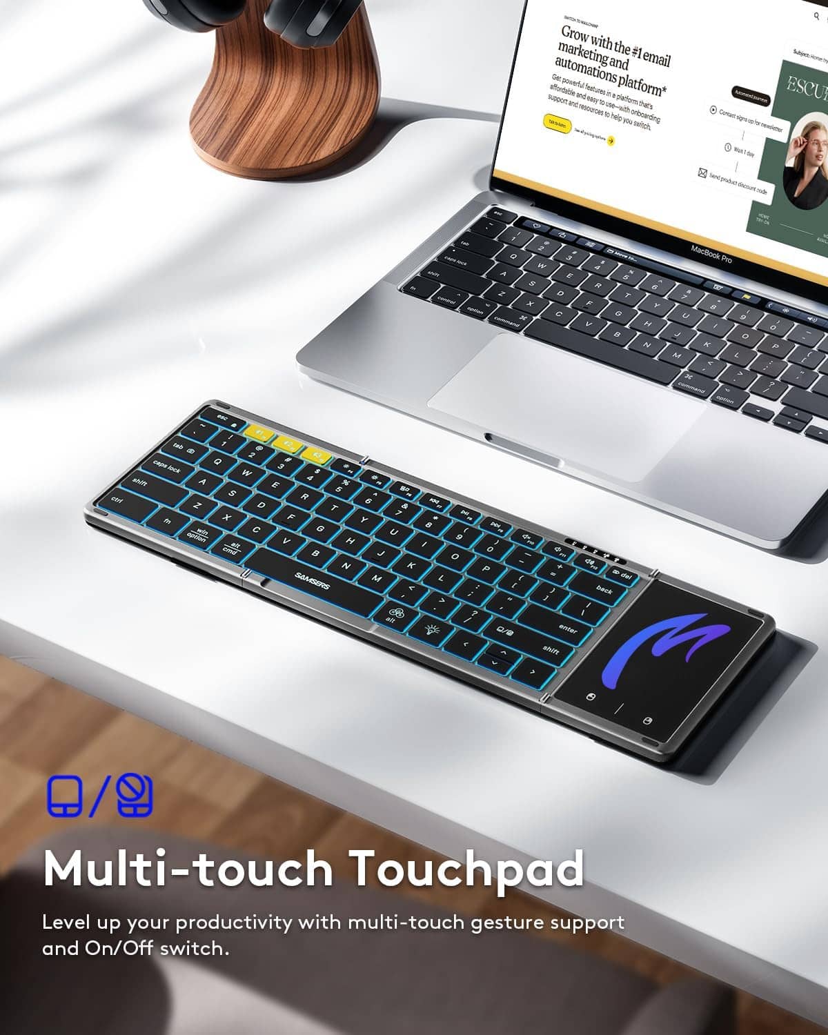 Foldable keyboard featuring a multi-touch touchpad and blue backlit keys