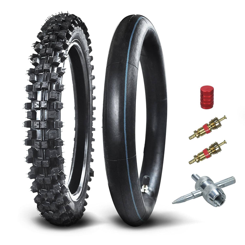 Black knobby front tire and inner tube with valve caps, valve cores, and tool