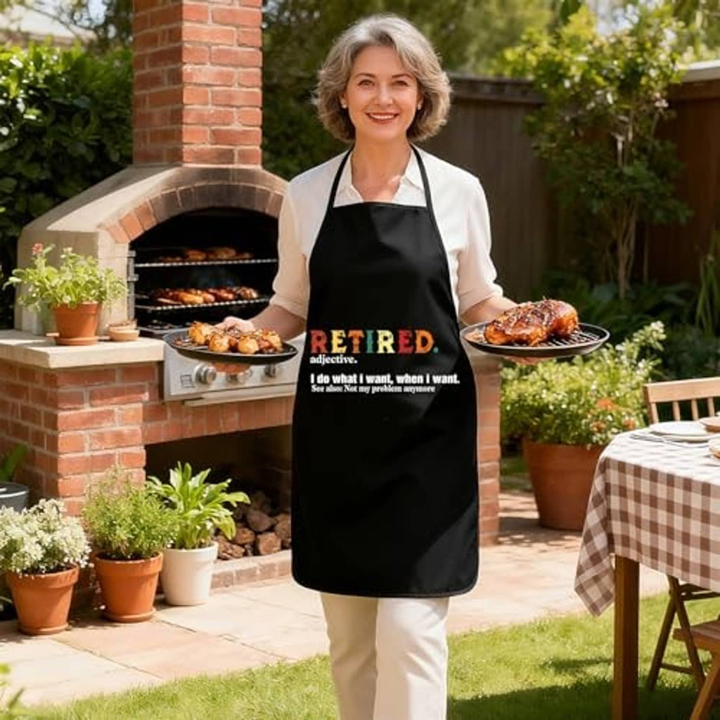 Black sleeveless apron with 'RETIRED' text on front worn outdoors