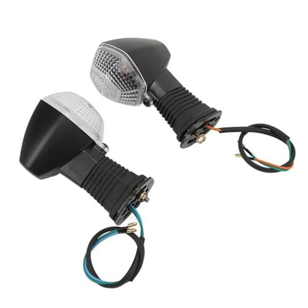 Set of motorcycle turn signal lights showing clear lenses and black ribbed mounting blocks