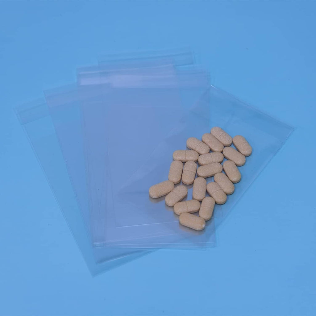 Clear self-sealing cellophane bag filled with beige tablets