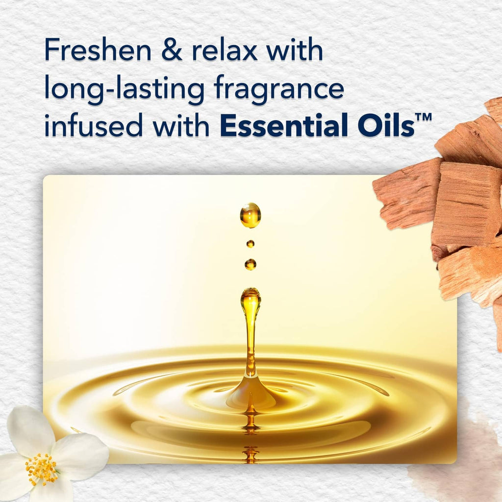 Glade Cashmere Woods scented oil refill with golden oil splash detail