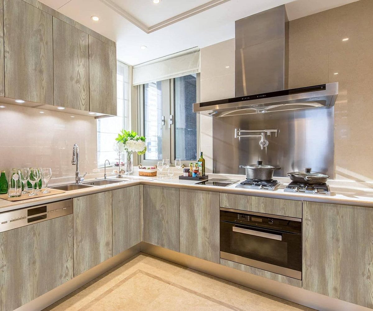 Faux wood grain contact paper on kitchen cabinets and counters, light oak finish