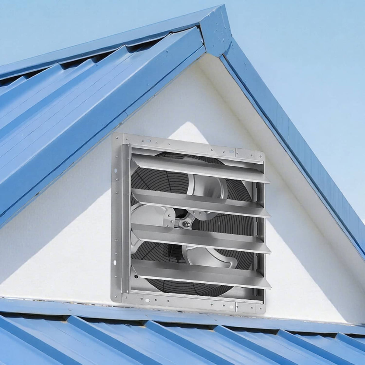Wall-mounted shutter exhaust fan installed under a roof eave