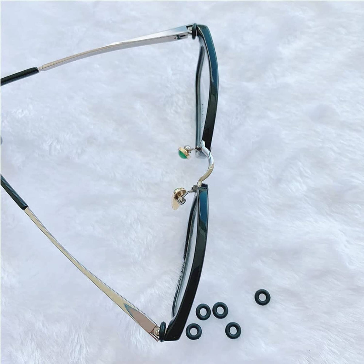 Eyeglass hinge repair kit, teal and black silicone rings and metal hinge pieces