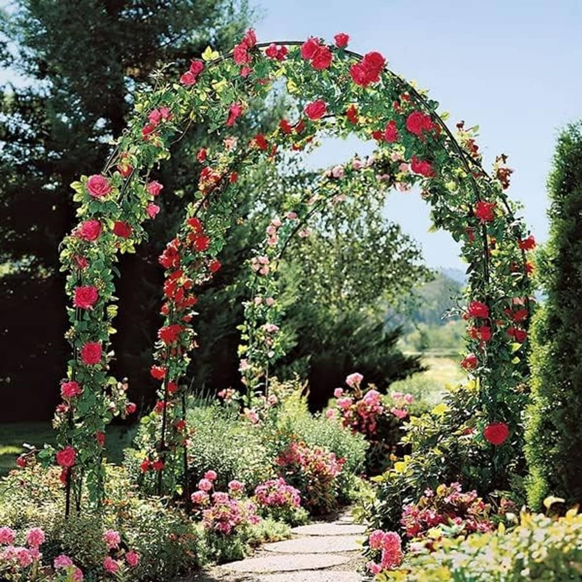 Garden arch trellis with dense red and pink rose floral decoration