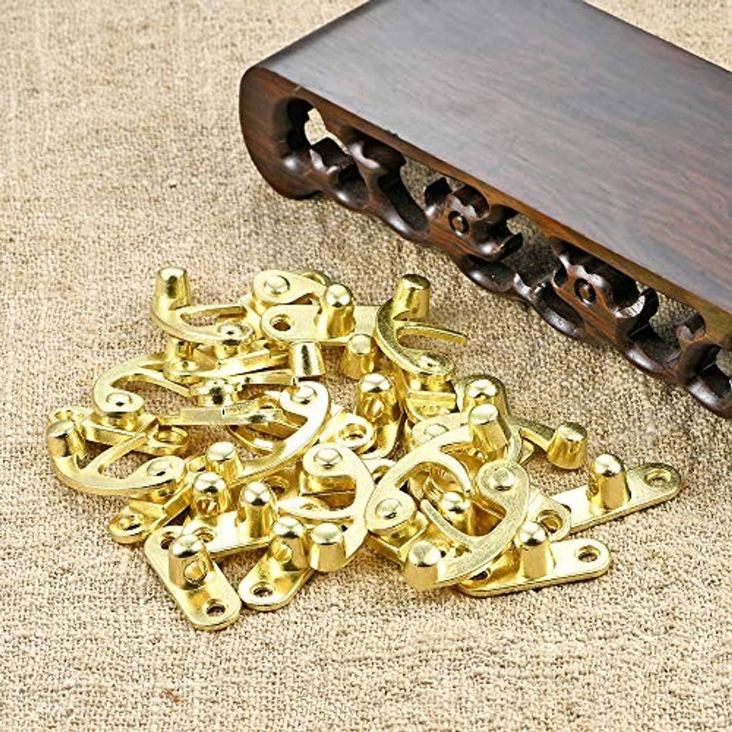 Antique gold jewelry box hinge and latch hardware with wooden box edge