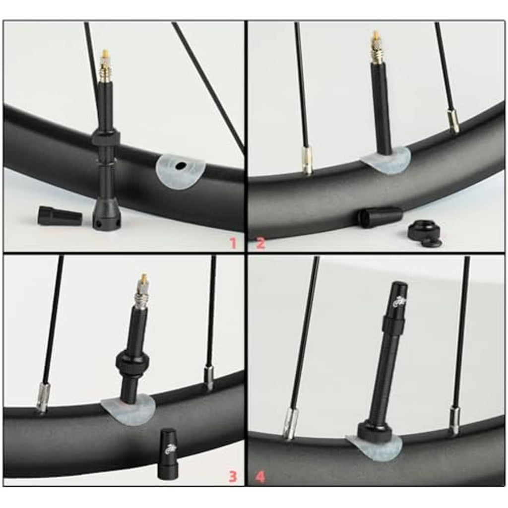 Presta bicycle valve stem installed in bike rim, with black stem and cap