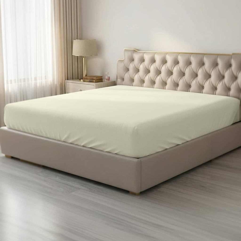 Light yellow twin fitted sheet with smooth surface and elastic edges for a snug fit