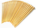 Multiple straight bamboo knitting needles set, neatly fanned with rounded end tips