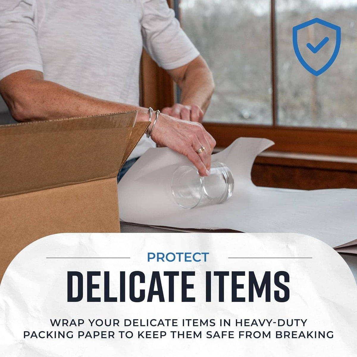 Newsprint packing paper wrapping a glass to protect delicate items from breaking