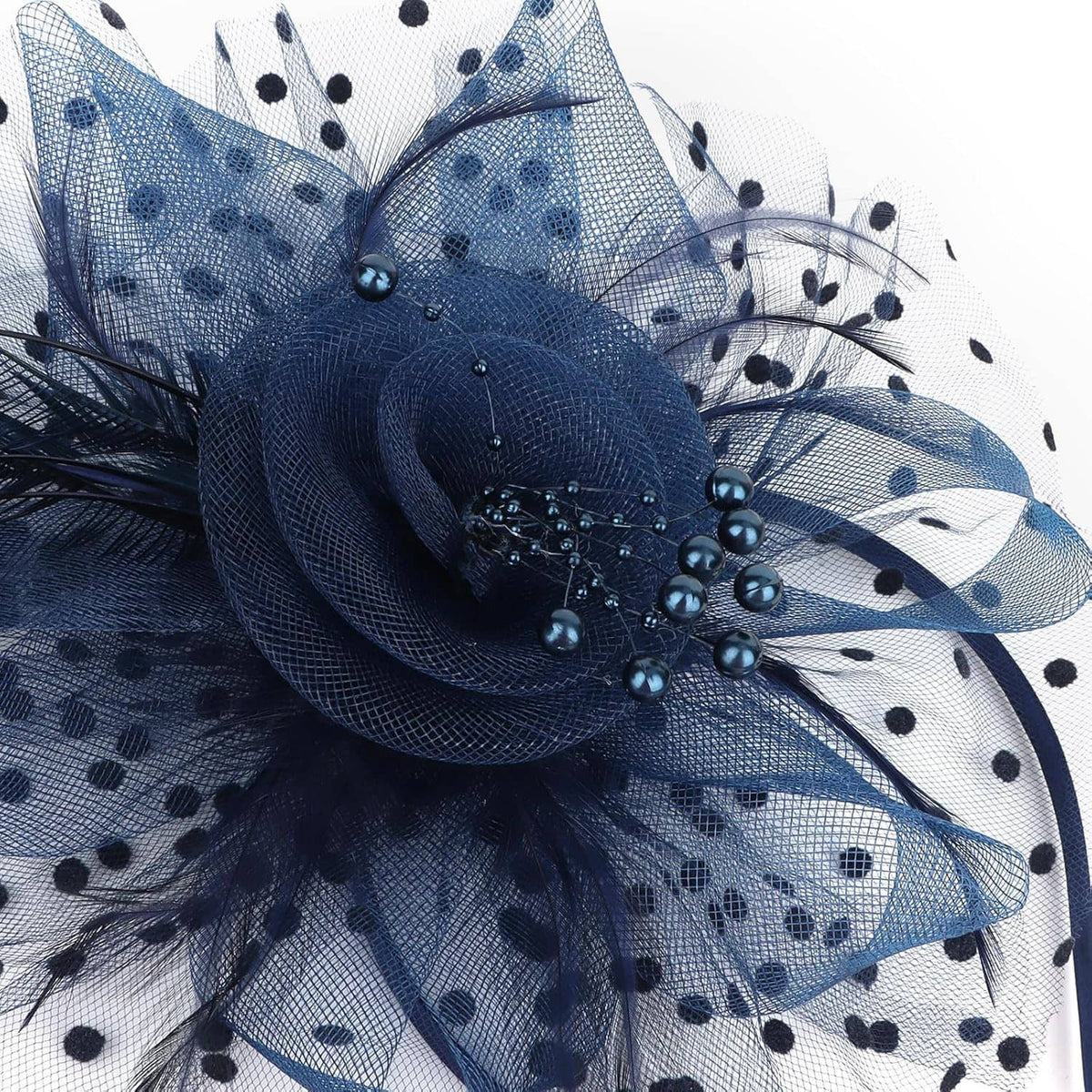 Navy polka-dot tulle fascinator flower with bead and feather detail