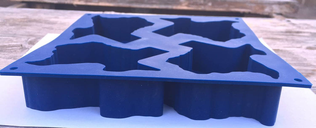Medium blue silicone baking mold tray with Texas-shaped cavities