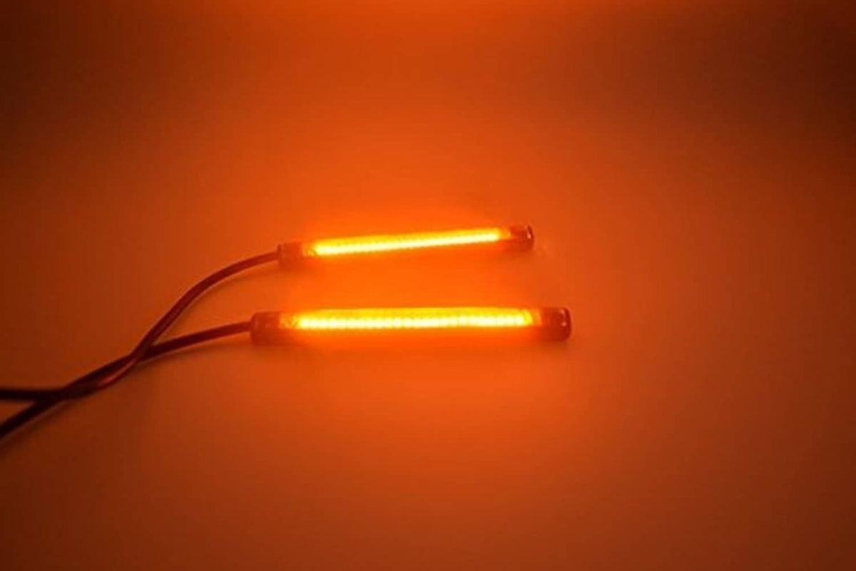 Two amber LED turn signal strips lit, showing warm yellow-orange LED bars