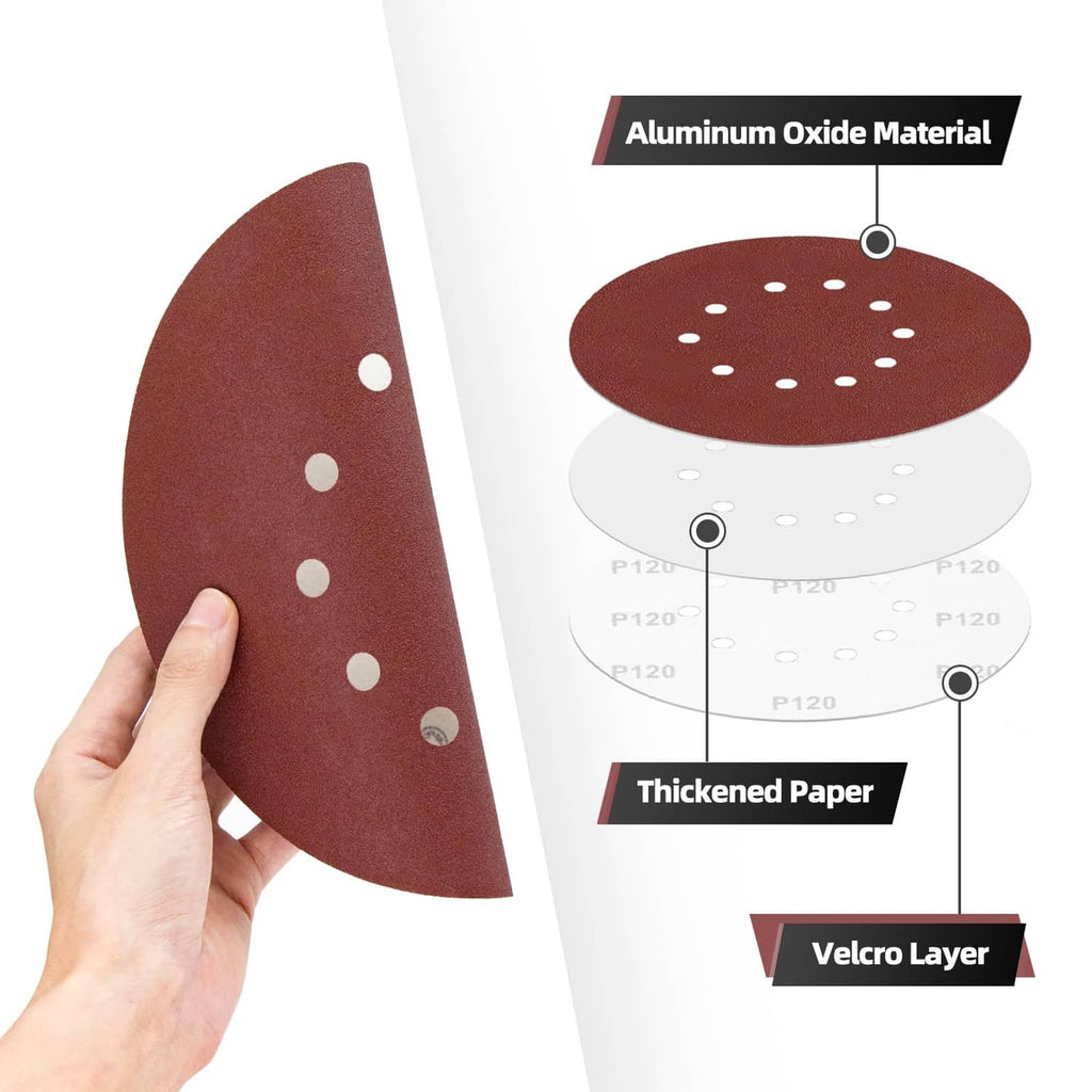 Held maroon 10-hole sanding disc showing layered construction and backing