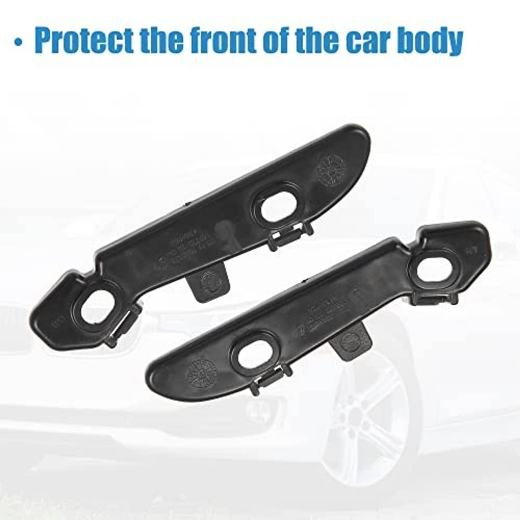 Pair of black plastic bumper mounting support brackets with two circular openings