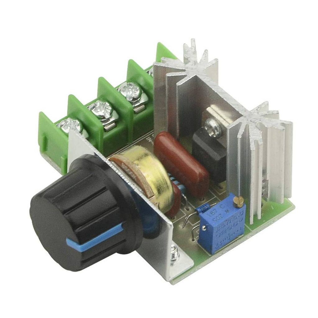 SCR voltage regulator module close-up, green PCB, heatsink, blue capacitor, screw terminals