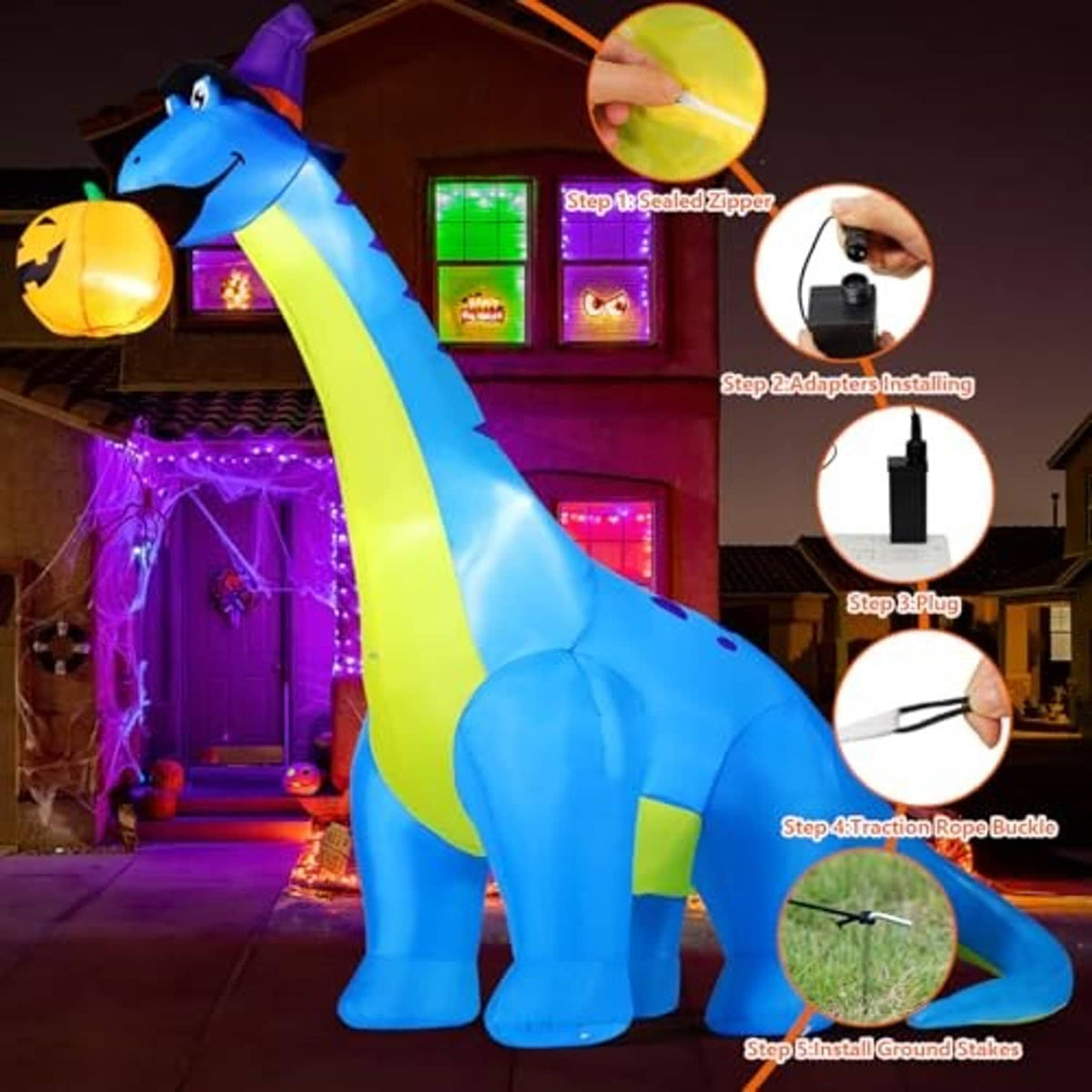 Inflatable blue dinosaur with green stripe and purple hat holding pumpkin with glowing lights