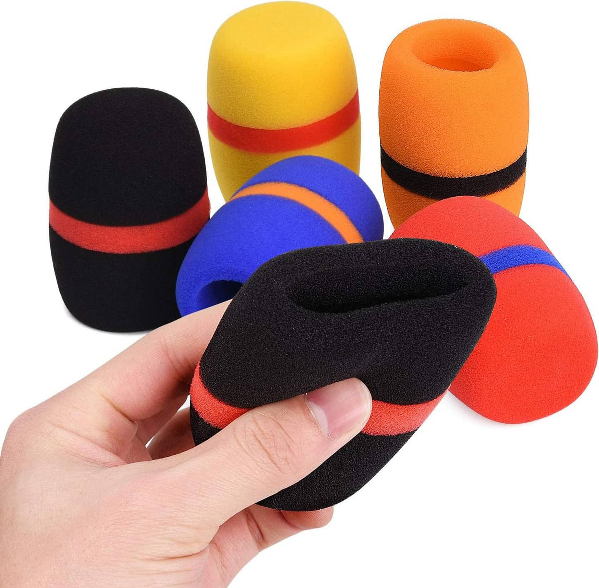 Hand holding black foam microphone windscreen with red and blue accent bands