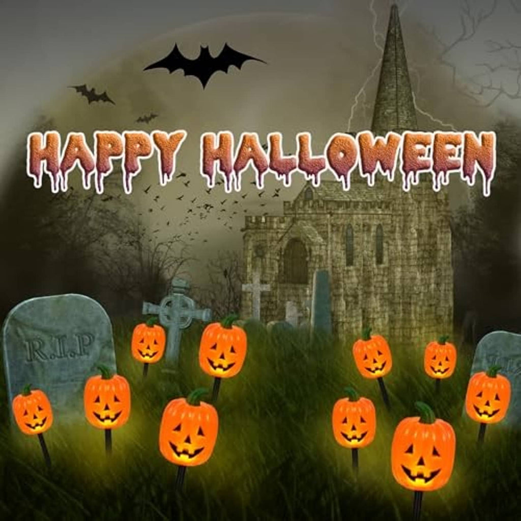 Pumpkin stake lights with glowing jack-o'-lantern faces scattered in yard