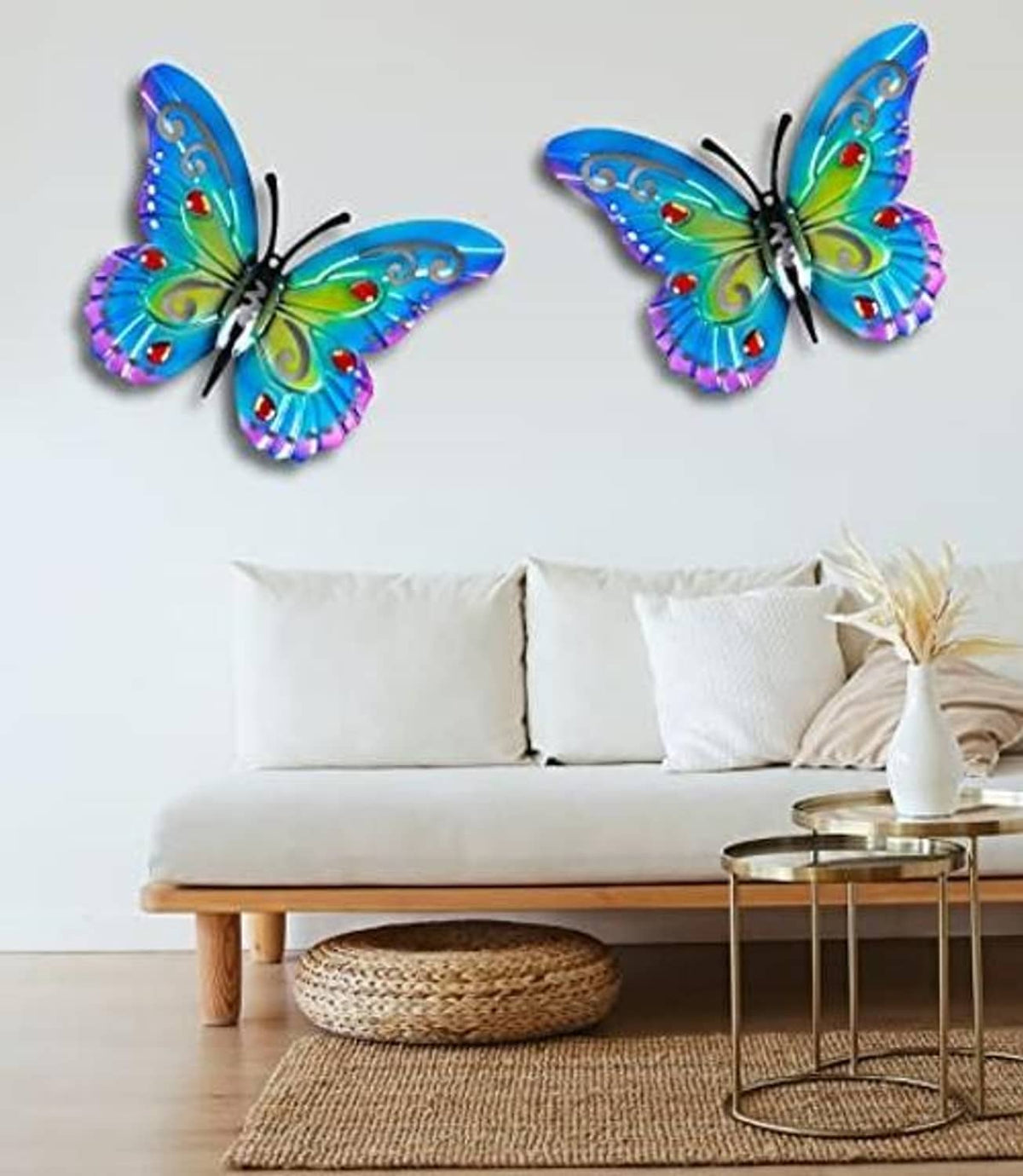 Two metallic butterfly wall decorations with blue wings and purple scalloped edges
