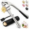 Stainless steel garlic press with black grip, perforated plate, and cleaning brush
