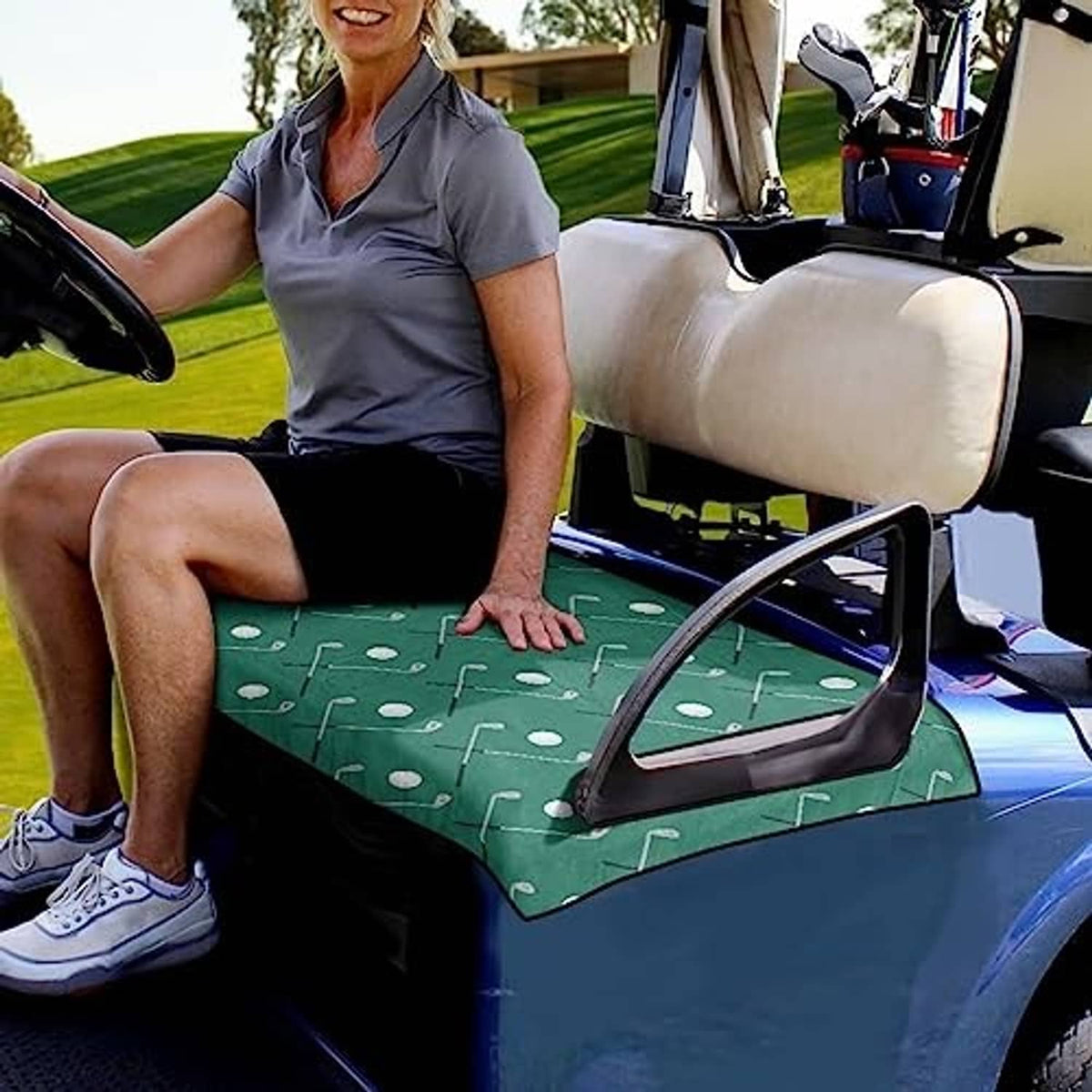 Green golf cart seat cover towel with white club pattern, placed on seat
