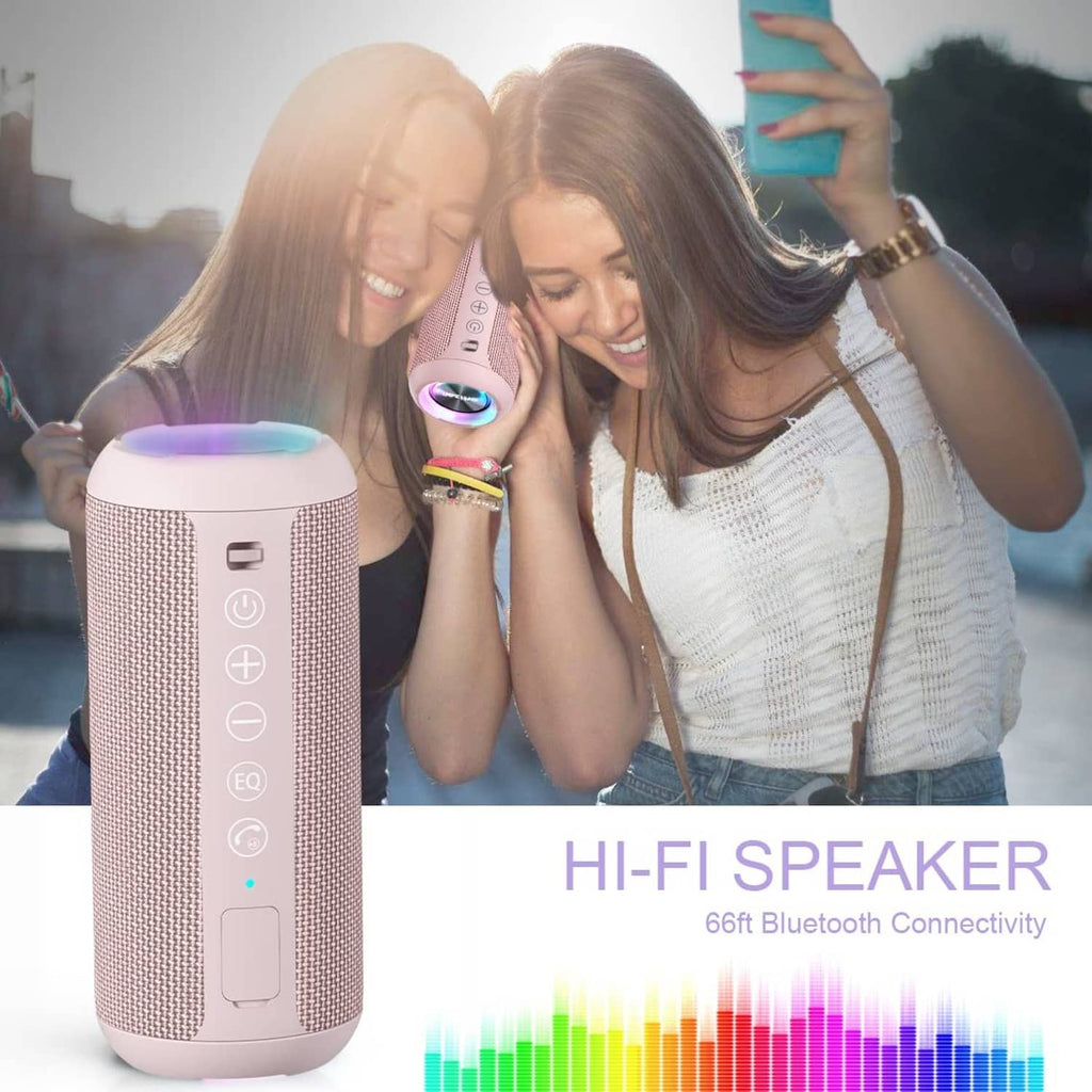 Pink portable Bluetooth speaker with glowing LED ring lights in front of people