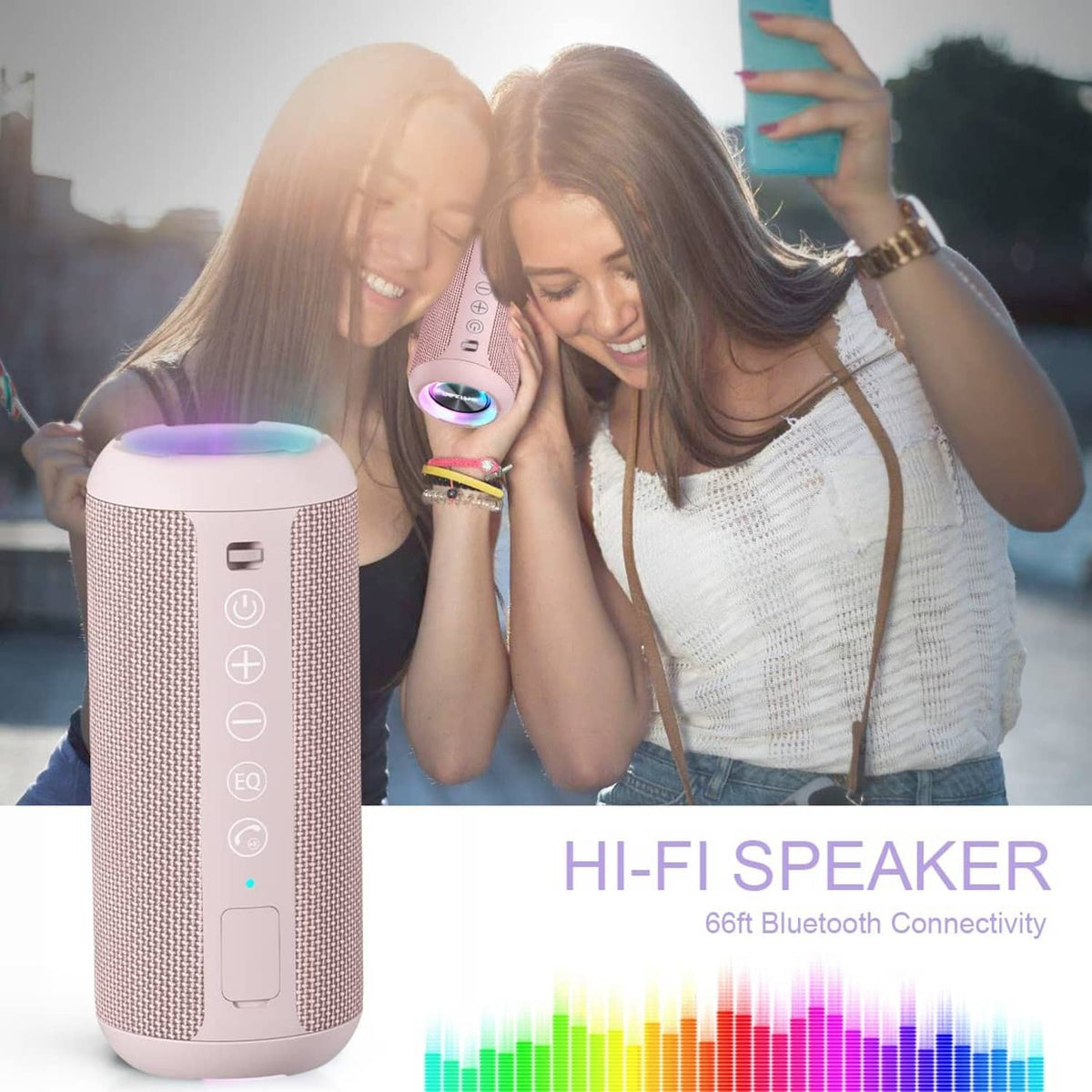 Pink portable Bluetooth speaker with glowing LED ring lights in front of people