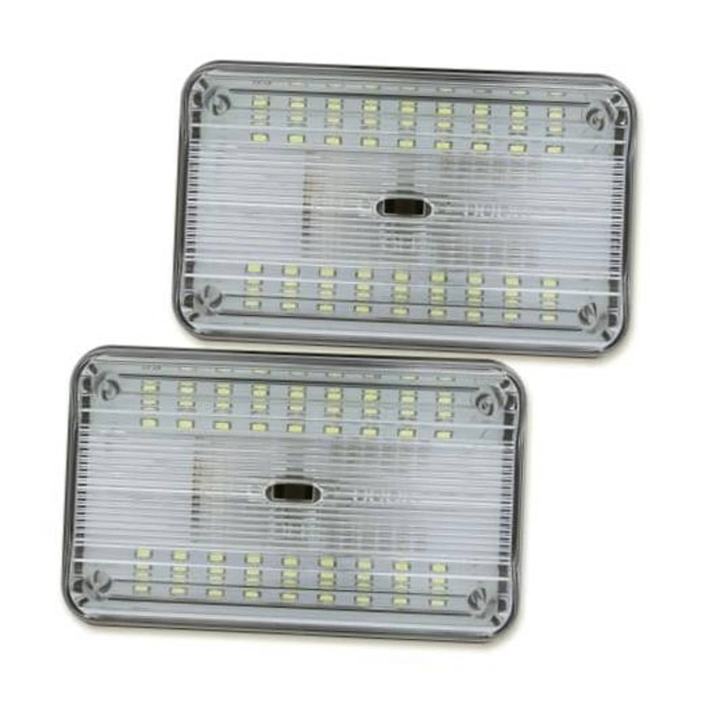 Clear-lens 12V dome LED light with chrome bezel, two mounting screws visible.