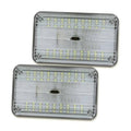 Clear-lens 12V dome LED light with chrome bezel, two mounting screws visible.