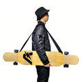 Black longboard sling shoulder carrier backpack with straps, worn carry stance.