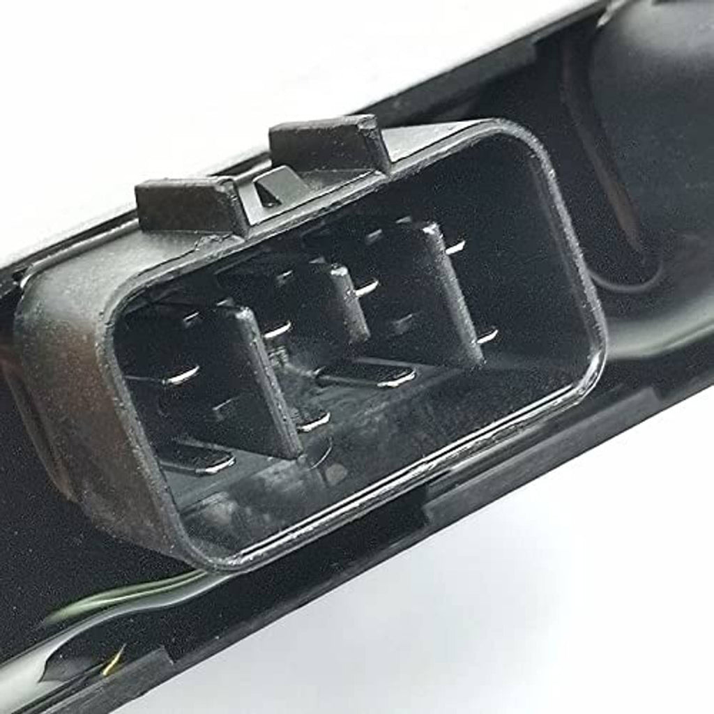 Close-up of CDI ignitor module with two multi-pin connector openings