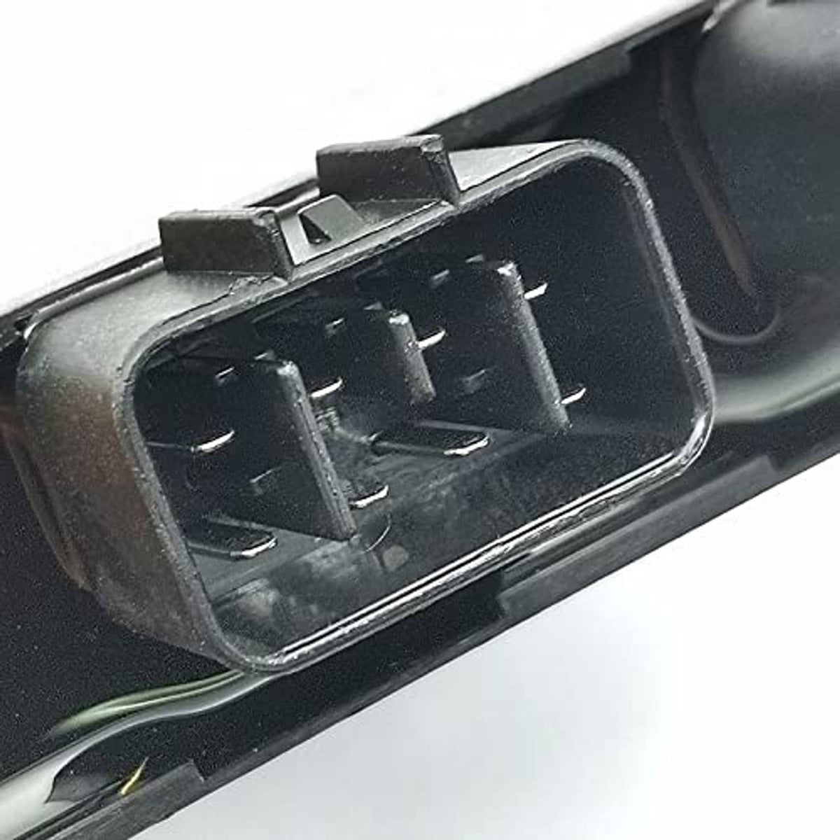 Close-up of CDI ignitor module with two multi-pin connector openings