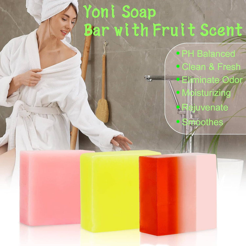 Colorful handmade soap bars in pink, yellow, orange, and light pink on a counter